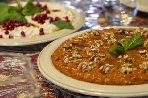 Red Muhammara close-up on table. horizontal top view , hot pepper Stock Photos