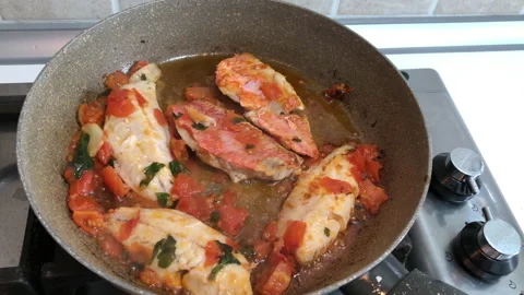 Red mullet cooked with tomato in a grey pot Stock-Footage 138464549
