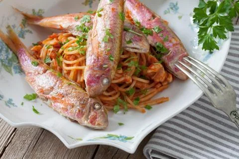 Red Mullet Fish On Spaghetti Stock Photos