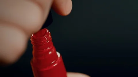 Red Nail polish brush taken out in extreme close up Stock Footage 101769578