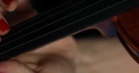 Red nails and violin strings against blue background Stock Footage 269846271