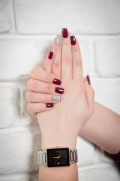 Red nails, shell on the nail, manicure Stock Photos