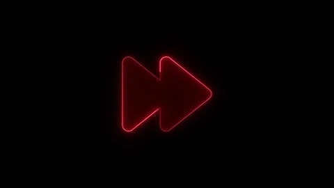 Red neon fast forward icon glowing against dark black background for multim.. Stock Footage 345549792