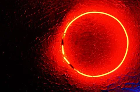 Red neon light illuminating the interior of a modern pub Stock Photos