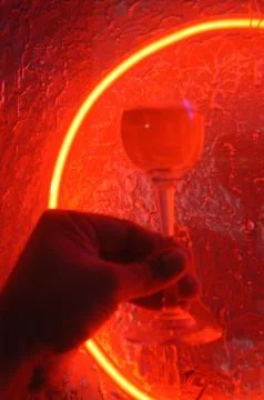 Red neon light illuminating the interior of a modern pub Stock Photos