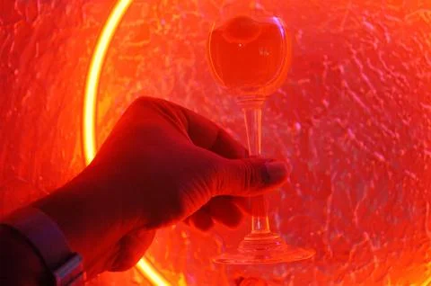 Red neon light illuminating the interior of a modern pub Stock Photos