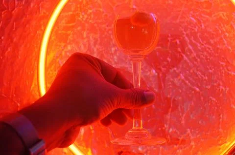Red neon light illuminating the interior of a modern pub Stock Photos