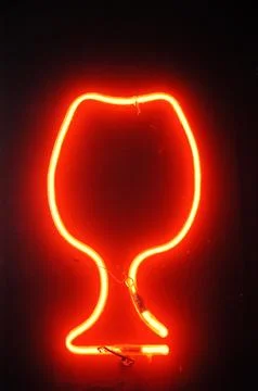 Red neon light illuminating the interior of a modern pub Stock Photos