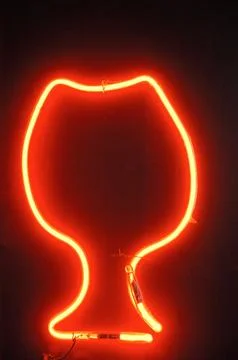 Red neon light illuminating the interior of a modern pub Stock Photos