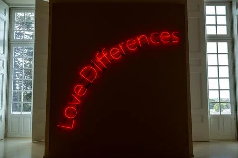 Red neon Love Differences text in gallery Photos