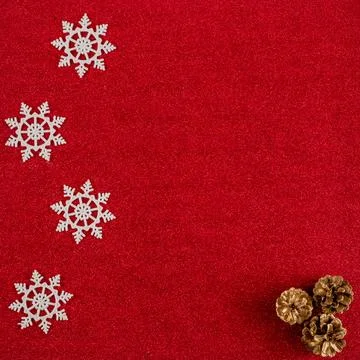 Red New Year's background with cones and snowflakes Stock Photos