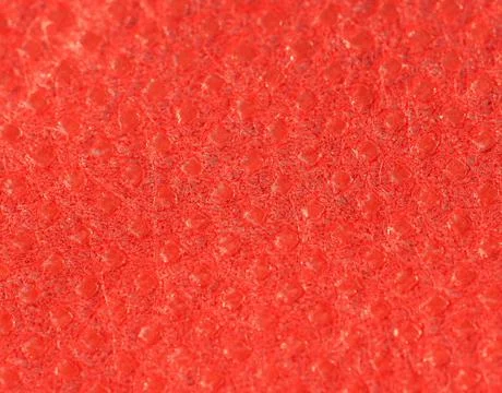 Red nonwoven polypropylene fabric texture background Stock Photos