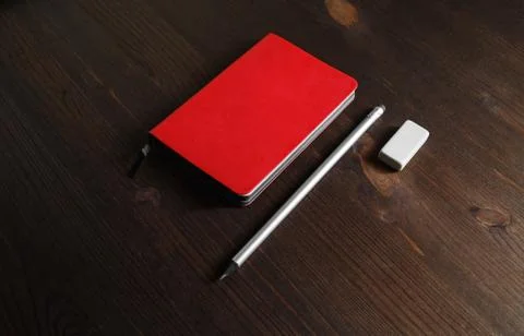 Red notebook, pencil, eraser Stock Photos
