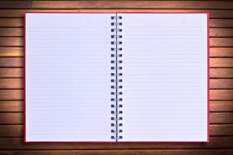 Red notebook on wood background Stock Photos