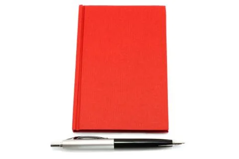 Red notepad with ball pen Stock Photos