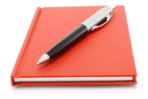 Red notepad with ball pen Stock Photos