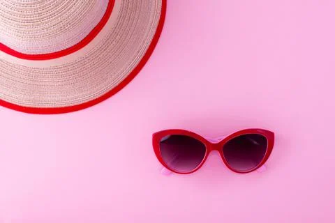 A red notepad on a light pink background. Stock Photos