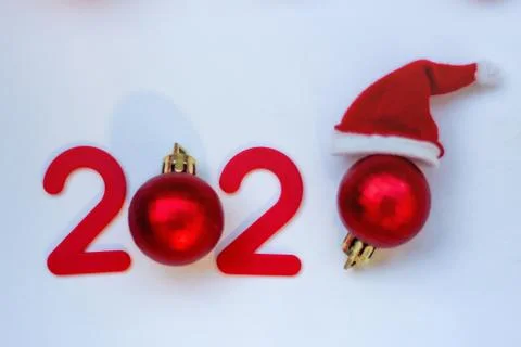 Red numbers and Christmas toys on the Christmas tree in the form of balls Stock Photos