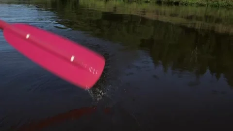 Red Oar Plunges into the Water of the River. Rowing. Oar Blade. Stock Footage 291323367