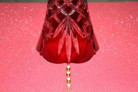 A red object on the pink surface. Stock Photos