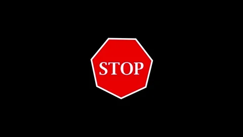 Red octagonal stop sign appearing on black background with white outline an.. 库存影片 332158392