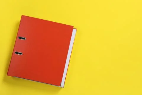 Red office folder on yellow background, top view, Space for text Stock Photos