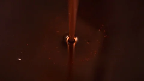 Red oily liquid pours beautifully. Oil and foam. Stock Footage