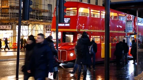 Red old and modern double decker bus start at traffic light, London, UK 스톡 동영상 116136623
