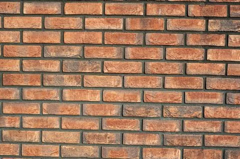 Red old brick wall background, brick wall texture, structure. old broken br.. Stock Photos