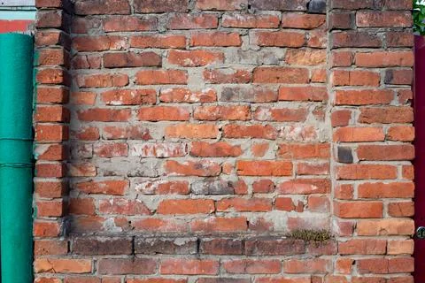 Red old brick wall background, brick wall texture. Brick old, destroyed red w Stock Photos