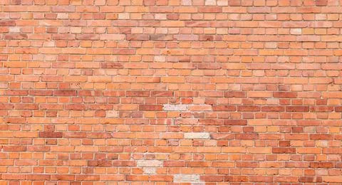 Red old brick wall with gray joints Stock Photos
