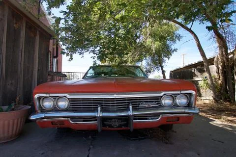 Red old car under a tree in Seligman, Arizona Stock Photos