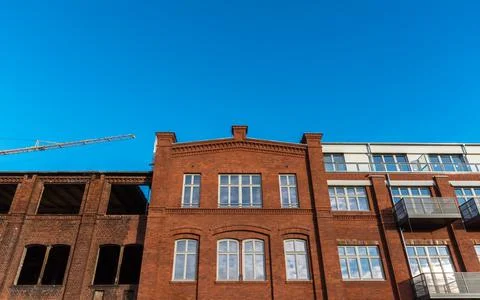 Red old clinker facade modernized and not renovated Stock Photos