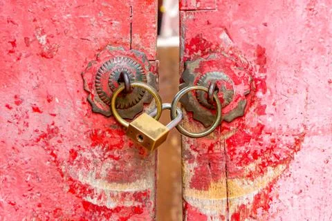 Red old door knocker with lock Stock Photos