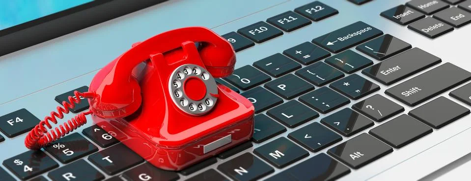 Red old retro telephone on computer laptop keyboard. 3d illustration Stock Illustration