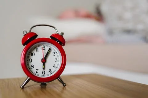 Red old style clock with sleeping man on background Stock Photos