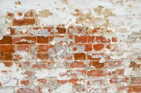 Red Old Weathered Brick Wall With Beaten Pieces Of Whitewash, Putty And Plast Stock Photos