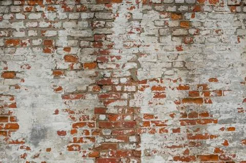 Red Old Weathered Brick Wall With Beaten Pieces Of Whitewash, Putty And Plast Stock Photos