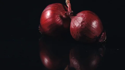 Red onion on a black background. Stock Footage 113204607