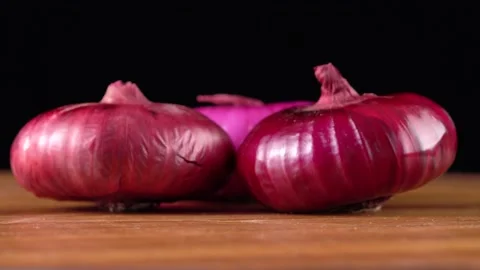 Red onion on black background Stock Footage 161982408
