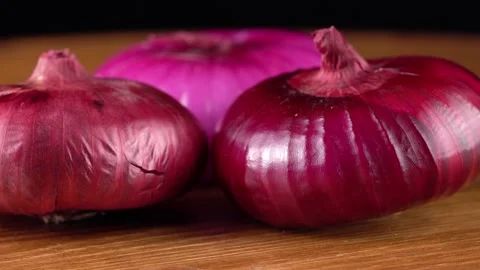Red onion on black background Stockbeeldmateriaal 162172252