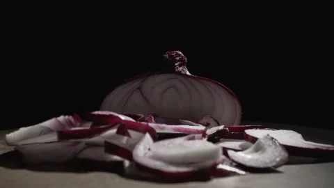 Red onion close up on black background Stock Footage 135736256