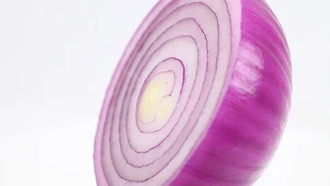 Red onion cut in half rotates spins around its axis, fresh juicy vegetable Stock Footage 123272148