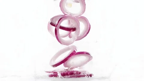 Red Onion Slices Falling and Rotating on White Background, Slow Motion Food Clip Stock Footage 332553896