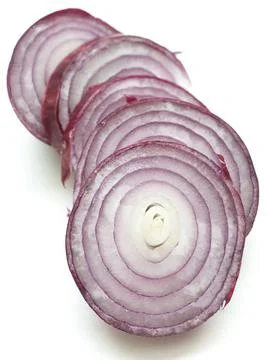 Red onion slices stack of fresh cut red onion slices isolated on white Cop... Stock Photos