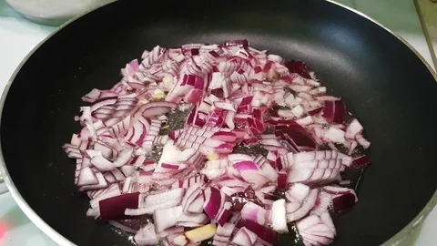 Red onions are fried in a pan Stock Footage 86307070