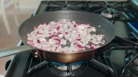 Red onions in skillet Stock Footage 299869302