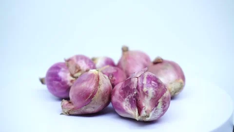 Red onions on a white background Stock Footage 218830443