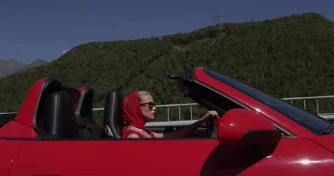 Red Open Cabriolet Moving on Rural Highway Stock Footage 159345503