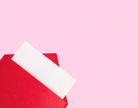 Red open envelope with a sheet of paper mock up on a pink background with cop Stock Photos